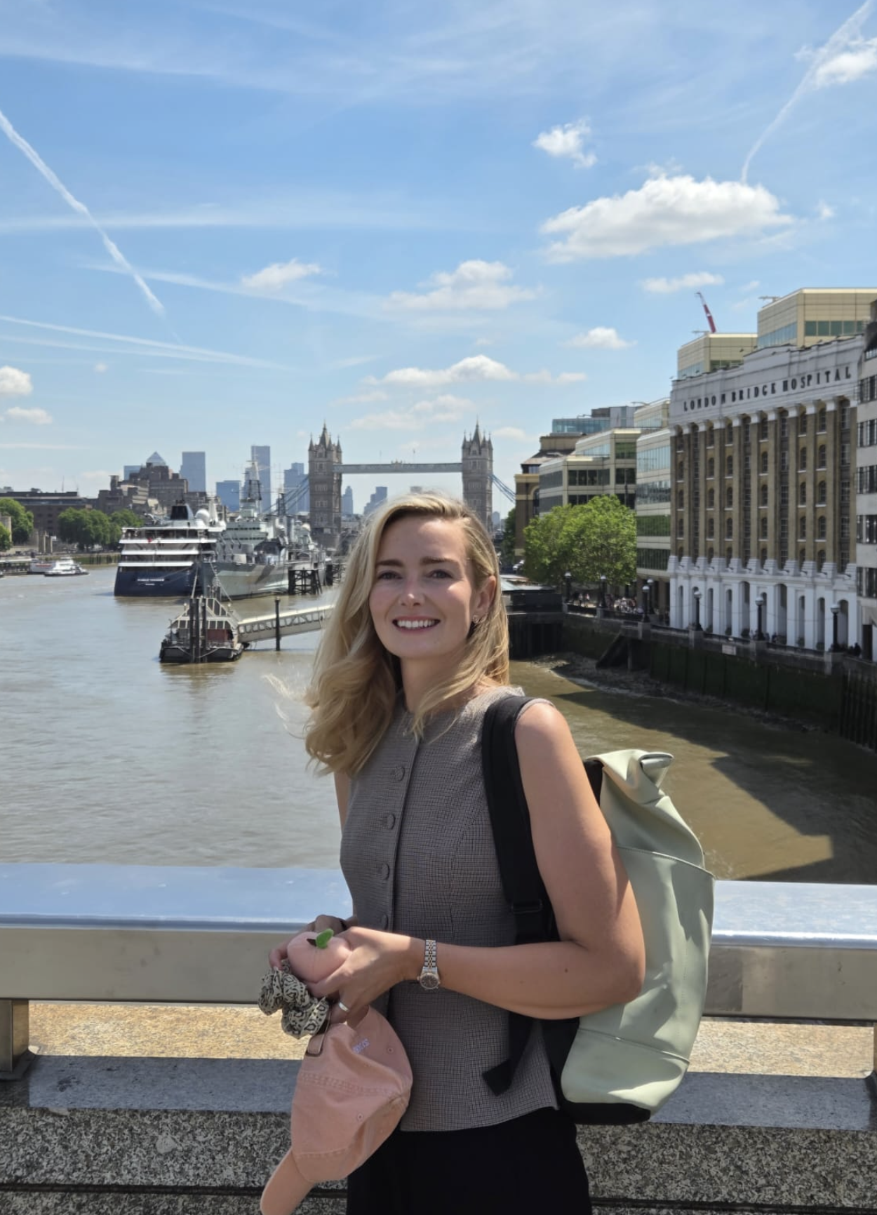SJ on London Bridge with Tower Bridge and the Thames in the background